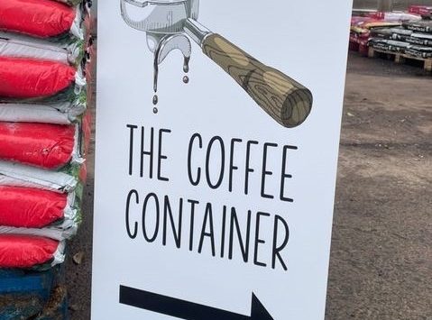 The Coffee Container Pavement Sign.